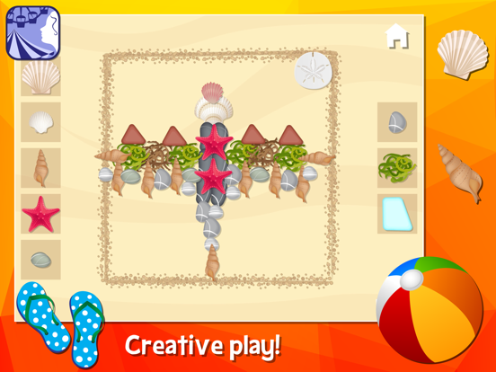 Shells, stones, and other beach objects arranged into a picture on the sand.